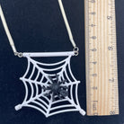 Spiderweb necklace made with upcycled LEGO® and matching cord