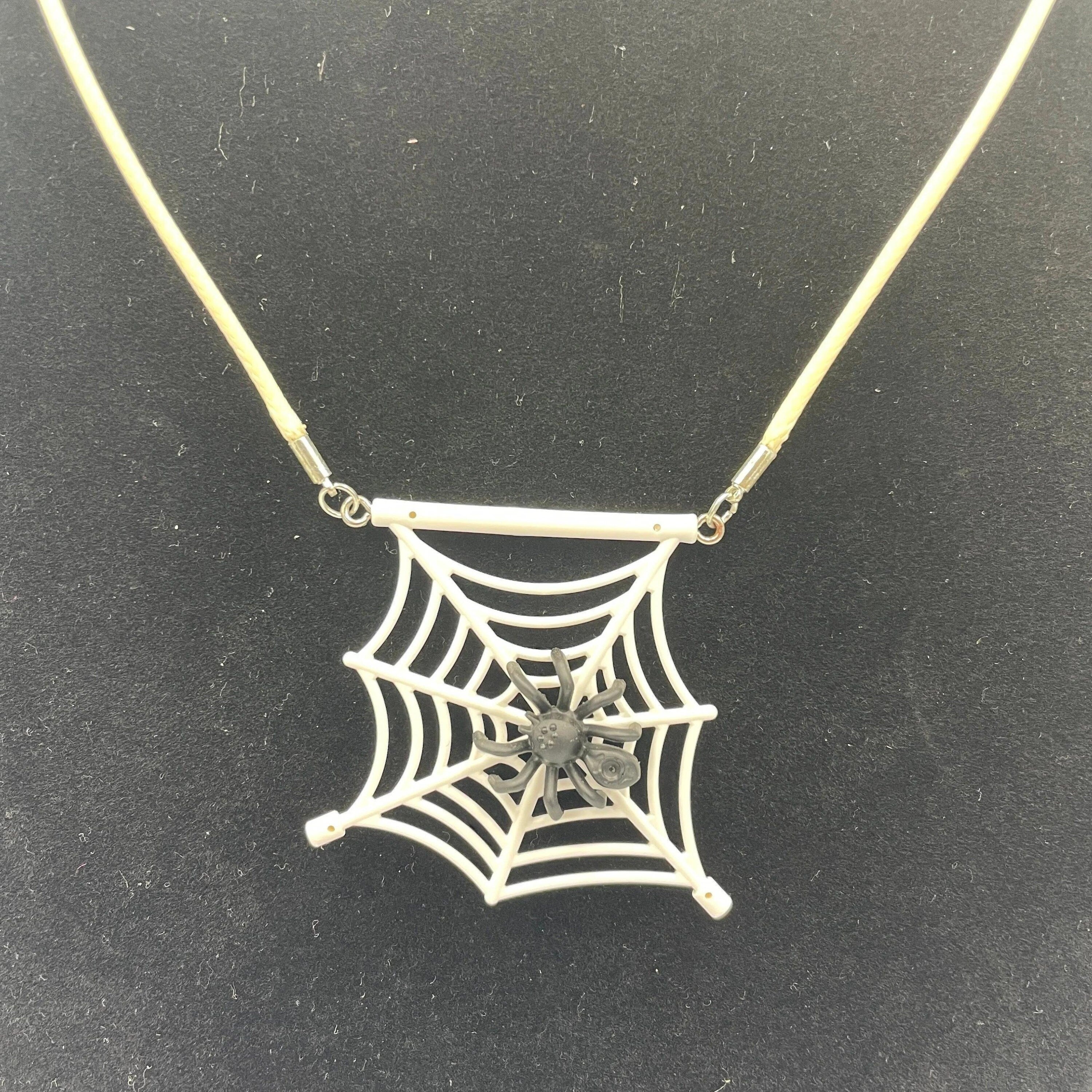 Spiderweb necklace made with upcycled LEGO® and matching cord