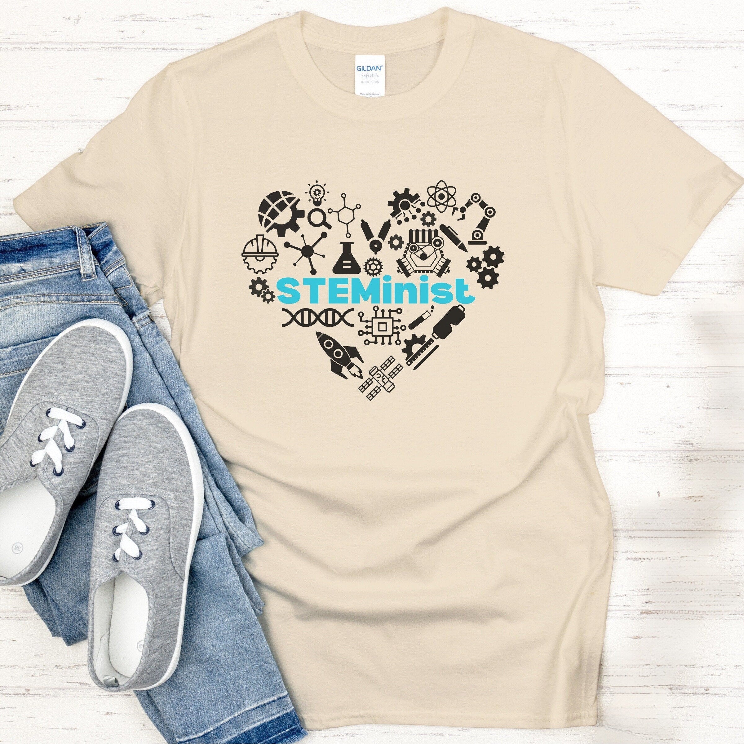 Graphic STEMinist Heart T-shirt. Women in STEM Science, Engineering, Tech and Math Sand