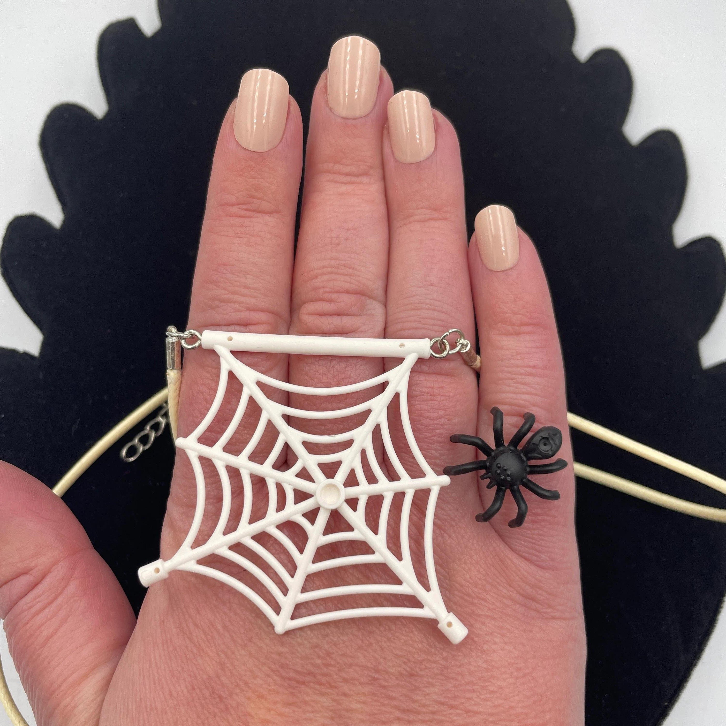 Spiderweb necklace made with upcycled LEGO® and matching cord