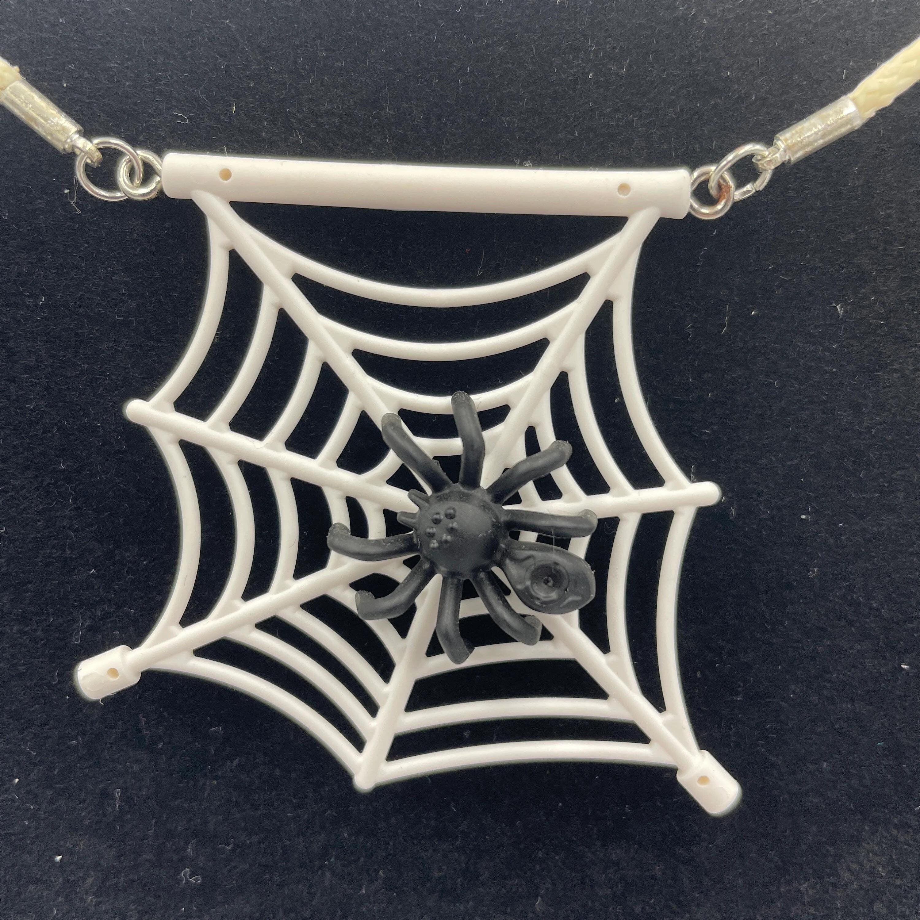 Spiderweb necklace made with upcycled LEGO® and matching cord