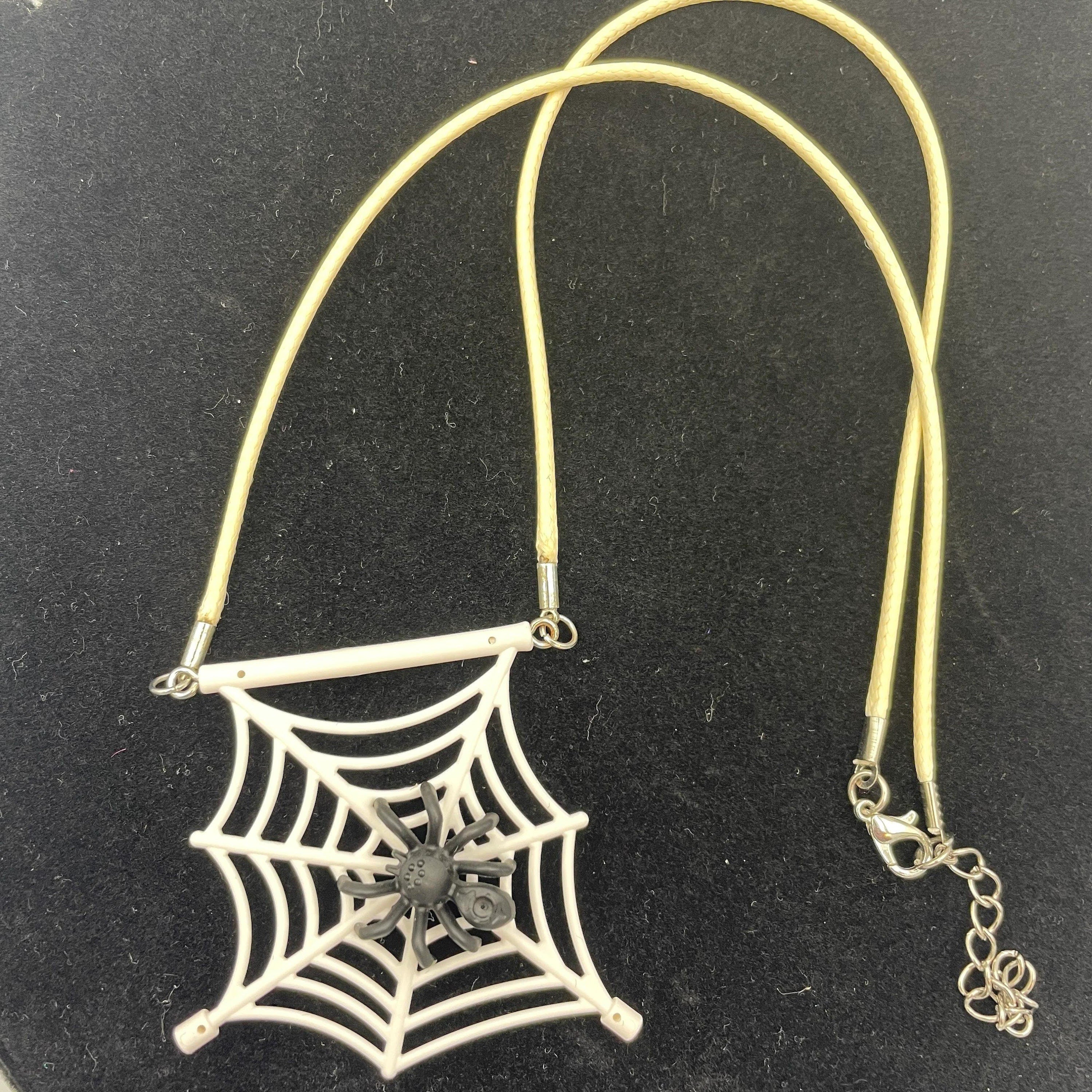 Spiderweb necklace made with upcycled LEGO® and matching cord