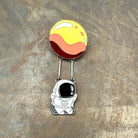 Astronaut Swinging from a Planet Enamel Pin Badge. Dangle Kawaii Space Science Brooch